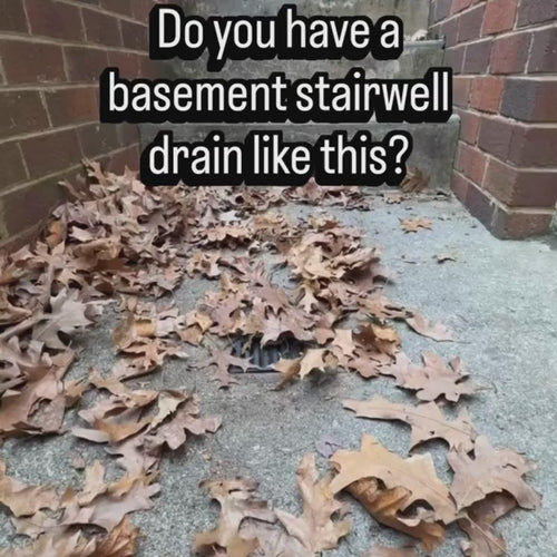 DrainDome being installed over a basement stairwell D-drain covered in leaves